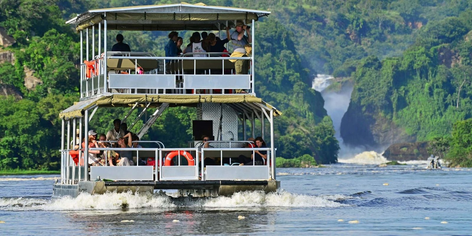 Boat cruise beneath the thundering Murchison Falls