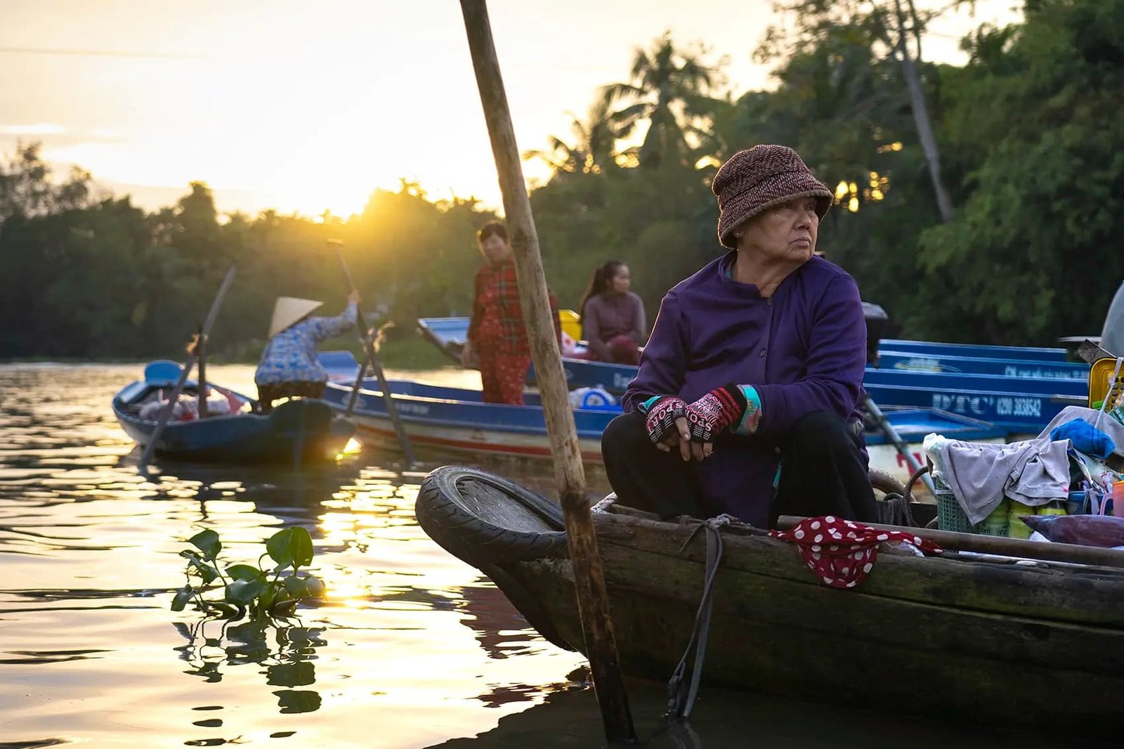 Boat through floating markets at sunrise