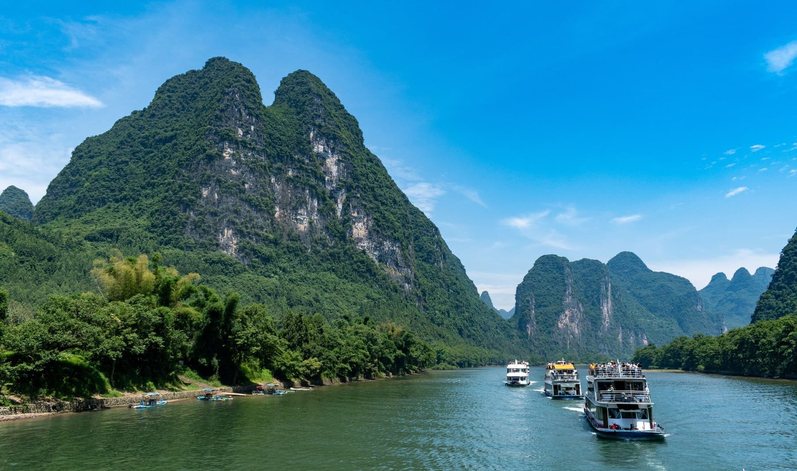 Cruise the Li River through karst mountain scenery