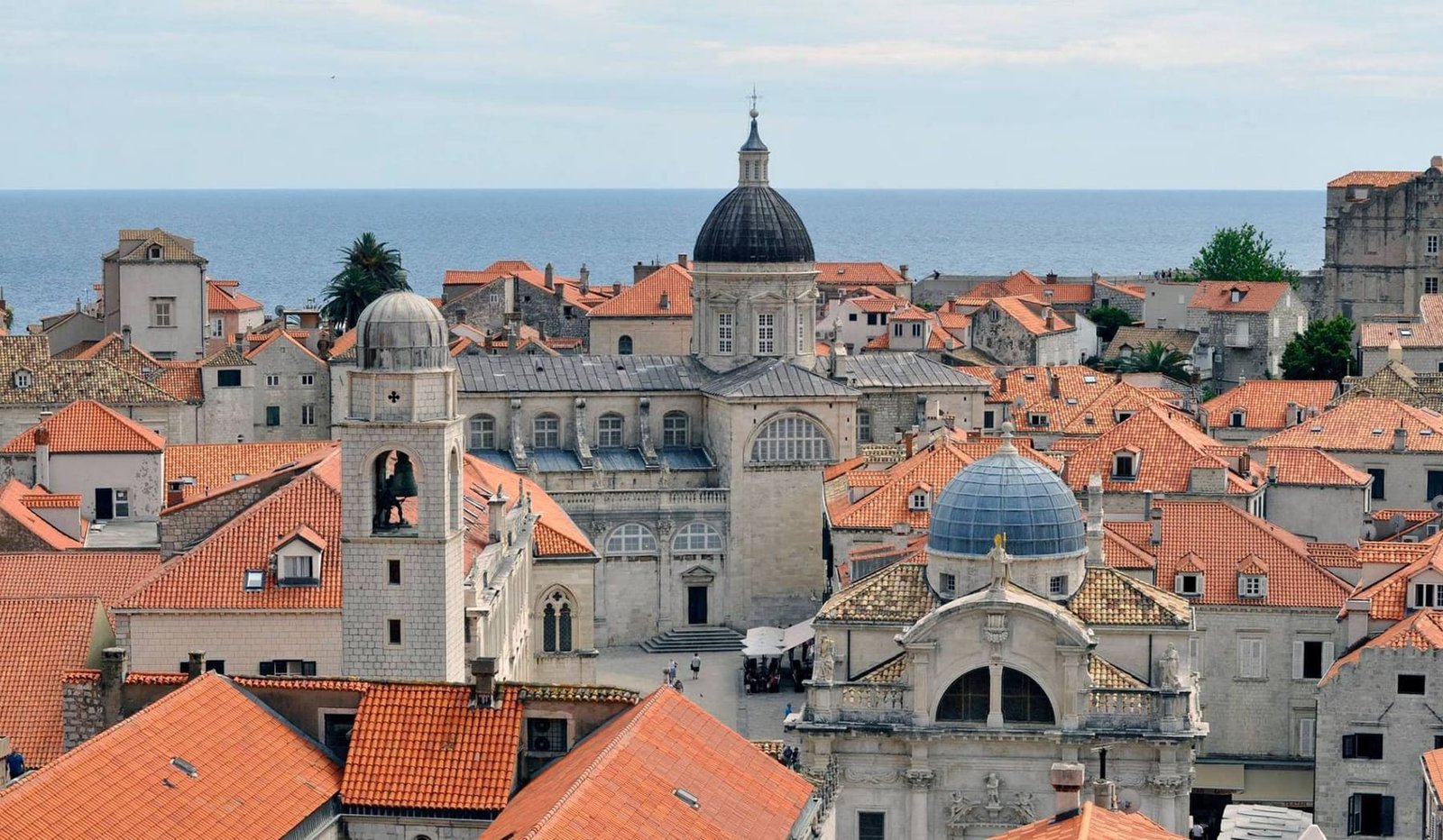 Walk the city walls above the terracotta rooftops