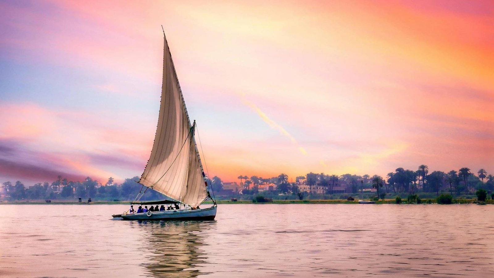 Felucca sailing on the Nile at sunset