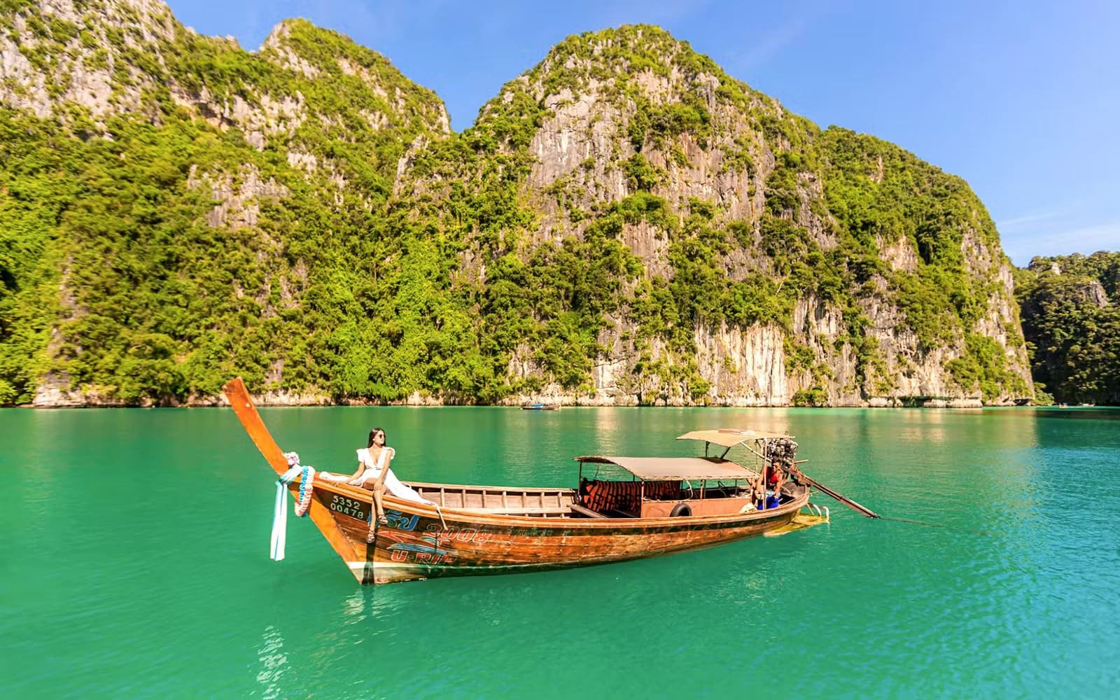 Longtail boat tour among limestone karst islands