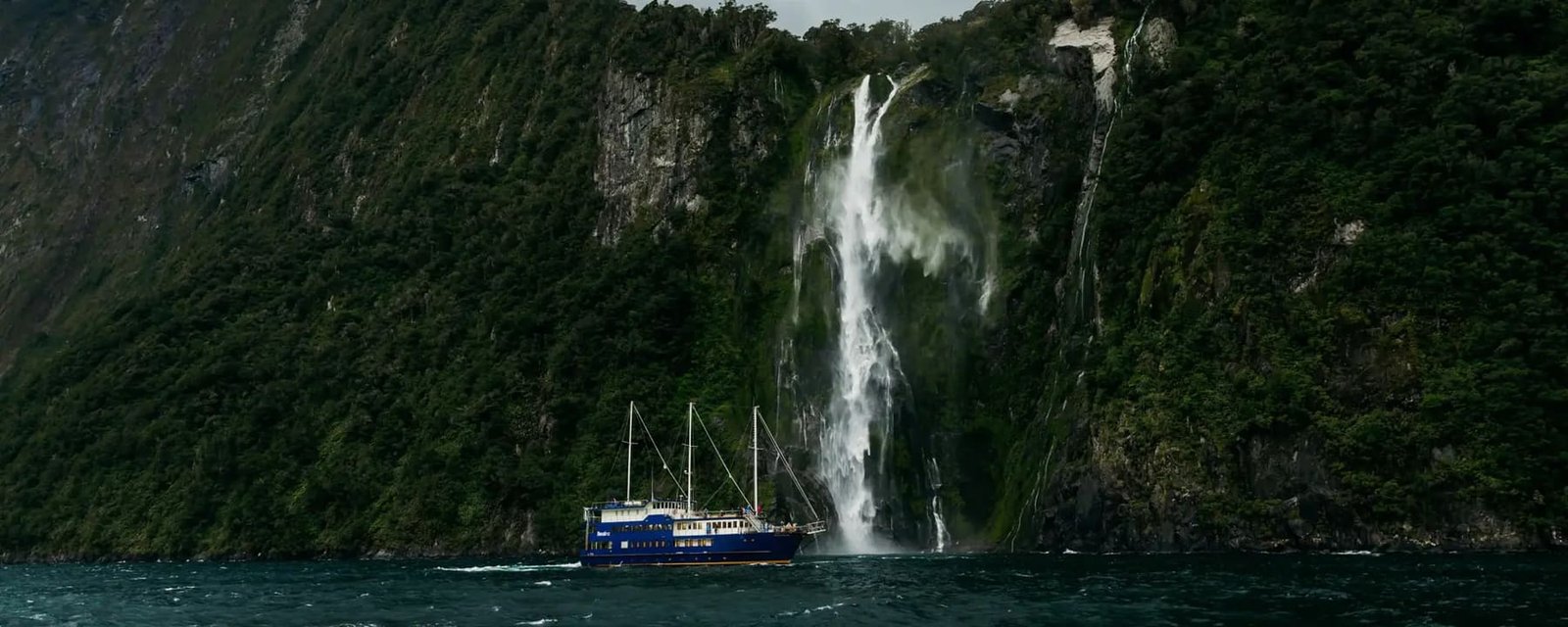 Cruise beneath Mitre Peak and Stirling Falls