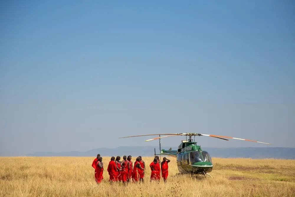 A Maasai group beside the helicopter